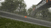 a sign that says brands on it over a race track