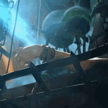 a person in a cage with a blue light shining on their arm
