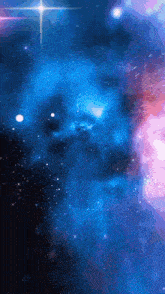 a blue and pink galaxy with a star in the center