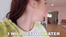 a close up of a woman 's face with the words " i will see you later " on the bottom