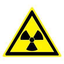 a yellow triangle with a black nuclear symbol in the center