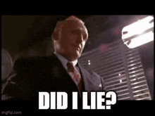 a man in a suit and tie is standing in front of a light and says `` did i lie ? ''
