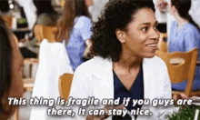 a woman in a lab coat says " this thing is fragile and if you guys are there , it can stay nice "