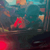 a man in a mask is sitting in the driver 's seat of a vehicle