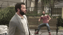 a man in a suit stands next to a man with a beard on a bench