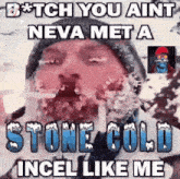 a man with ice on his face is wearing a beanie and a hat .