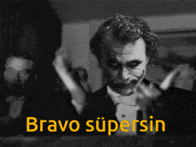 a black and white photo of the joker and the words bravo supersin in yellow