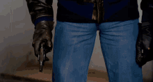 a close up of a man 's leather jacket shows the pockets