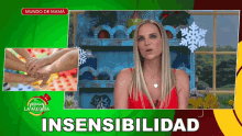 a woman in a red top talks about insensitivity