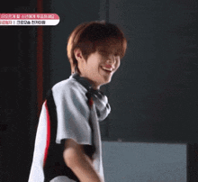 a young man wearing headphones and a shirt that says nct