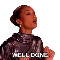 a woman in a metallic dress says " well done "