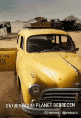 a yellow car with the number 0670 on the side of it