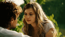 a man and a woman looking at each other