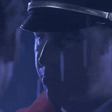 a close up of a man 's face in the dark