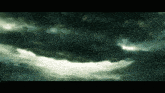 a dark cloudy sky with a few rays of light