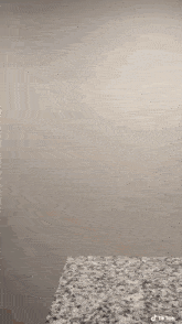 a man wearing headphones is jumping over a counter top