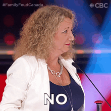 a woman speaking into a microphone says no