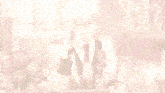 a man in a suit and tie is writing on a piece of paper in front of a flower vase