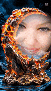 a woman 's face is behind a statue of lava and rocks