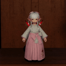 a little girl with white hair is wearing a pink and white kimono