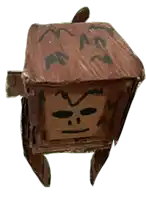a small cardboard box with a face drawn on it