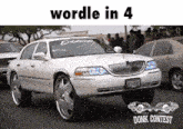a white lincoln limousine is parked in front of a crowd of people with the words wordle in 4 above it
