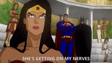 a cartoon of superman wonder woman and batman with the words she 's getting on my nerves below them