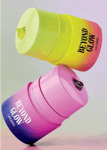 a pink and yellow bottle of beyond glow lipcerin