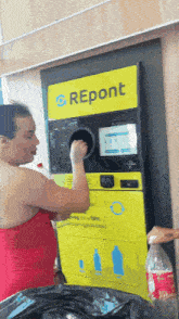 a woman is putting a bottle into a machine that says " repont "