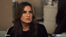 a woman 's face is shown with the nbc logo in the corner