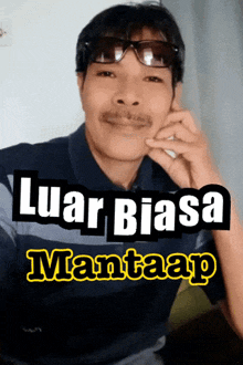 a man wearing sunglasses and a mustache with the words " luar biasa mantaap " on the bottom