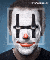 a man with a clown face painted with the letter h on his face