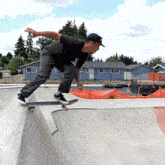 a man is riding a skateboard on a ramp in a skate park
