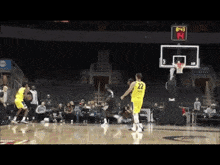 a basketball player wearing a yellow jersey with the number 22