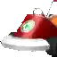 a close up of a red object with a green eye on it .