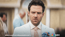 a man in a suit and tie is featured on a nbc ad