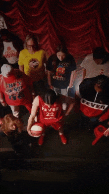 a group of people wearing shirts that say fever are standing together