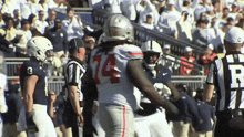 a football player with the number 14 on their jersey