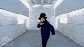a man in a top hat is standing in a room with a basilisk logo