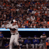 a baseball player with the number 12 on the back of his jersey