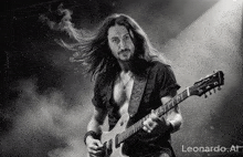 a man with long hair is playing a guitar in a black and white photo