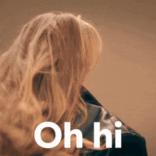 a woman 's hair is blowing in the wind and the words oh hi are above her