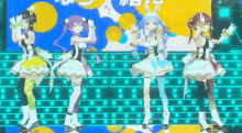 a group of anime girls are standing on a stage dancing together .