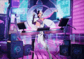 a woman is standing in front of a dj 's desk with a sign that says keychain on it