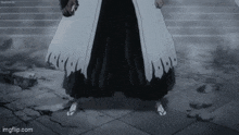 a black and white image of a samurai standing on a tiled floor .