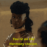 a woman says " you 're on the harmony station "