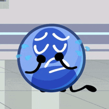 a blue ball with a sad face and tears coming out of its eyes