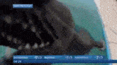 a close up of a shark 's teeth with a weather forecast in the background