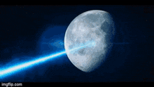 a blue light is coming from the moon in the night sky