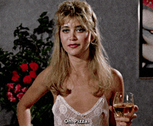 a woman is holding a glass of wine and says oh pizza
